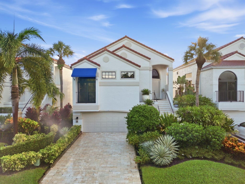 Photo of 13348 Mangrove Isle Drive, Palm Beach Gardens, FL 33410 (MLS # B26079945)
