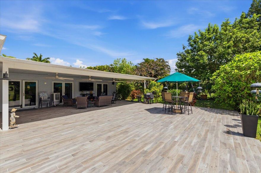 IF YOU'RE SEARCHING FOR PEACEFUL COUNTRY LIVING, WELCOME HOME! THIS DAVIE ESTATE HAS EXTENSIVE UPGRADES, FEATURING A FULLY RENOVATED HOME TUCKED ONTO JUST UNDER AN ACRE OF PRISTINE LAND. THREE BEDROOM TWO BATH PROPERTY BOASTS FULLY UPGRADED KITCHEN AND BATHS, NEW FLOORING, METAL ROOF (2019), FULL CAPACITY GENERATOR, WATER FILTRATION SYSTEM, IMPACT WINDOWS AND DOORS, ROOM FOR A FULL RV WITH 30/50 ELECTRIC HOOK UP, EXPANSIVE STAMPED CONCRETE DRIVE, MATURE FRUIT TREES AND PLENTY OF SPACE FOR A POOL, TENNIS COURTS OR EXPANSION.  SPACIOUS COVERED BACK PATIO EXTENDS TOWARD THE OVERSIZED BACK YARD PROVIDING PLENTY OF ROOM TO HOST EVEN YOUR LARGEST GATHERINGS. LIGHT, BRIGHT, AND OPEN WITH VIEWS OF NATURE THROUGHOUT. PRIDE OF OWNERSHIP IS REFLECTED IN EVERY ASPECT OF THIS STUNNING ESTATE.  NO HOA.