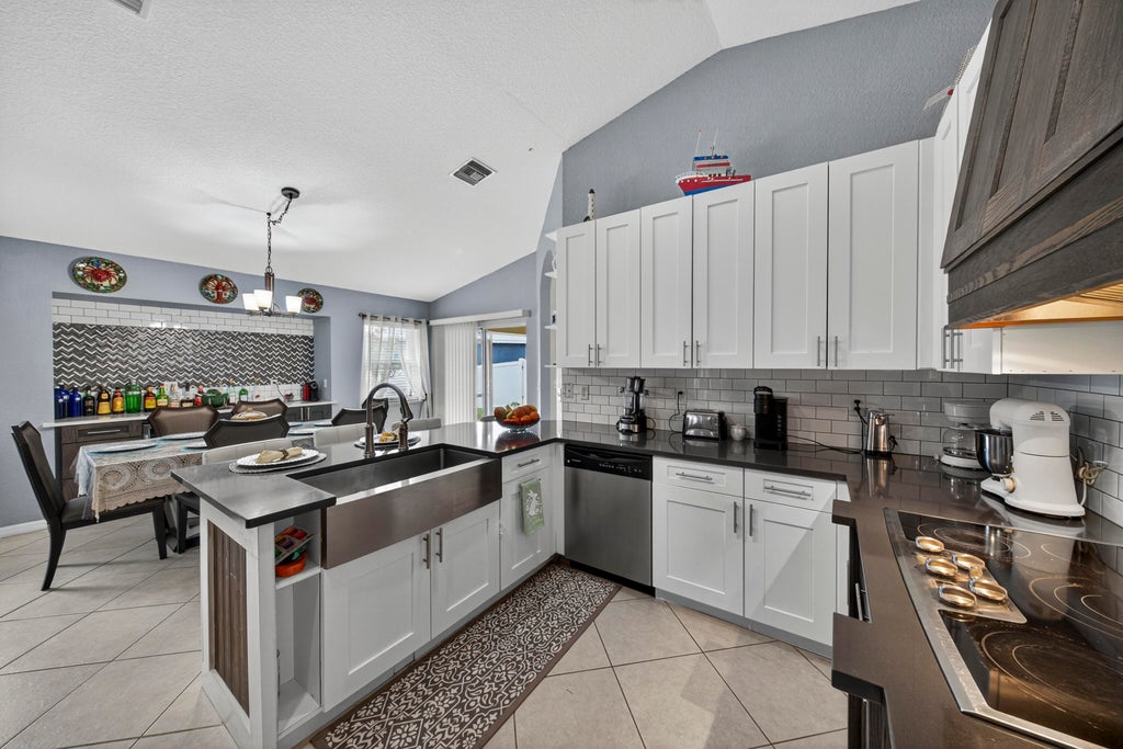 Photo of 412 SW David Terrace, Port Saint Lucie, FL 34953 (MLS # R11120498)