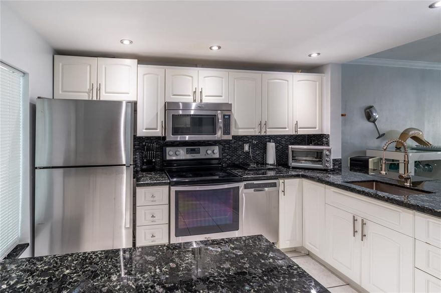 Live the island lifestyle in this comfortable, beautifully decorated 1-bedroom a bath and covered patio condo at Paradise Island featuring stunning canal views, a remodeled kitchen with granite countertops and stainless-steel appliances, a screened patio, parking right outside the door, and a prime location just minutes from Hallandale Blvd shops and the beach—also available for 6 month rentals, different rates apply.