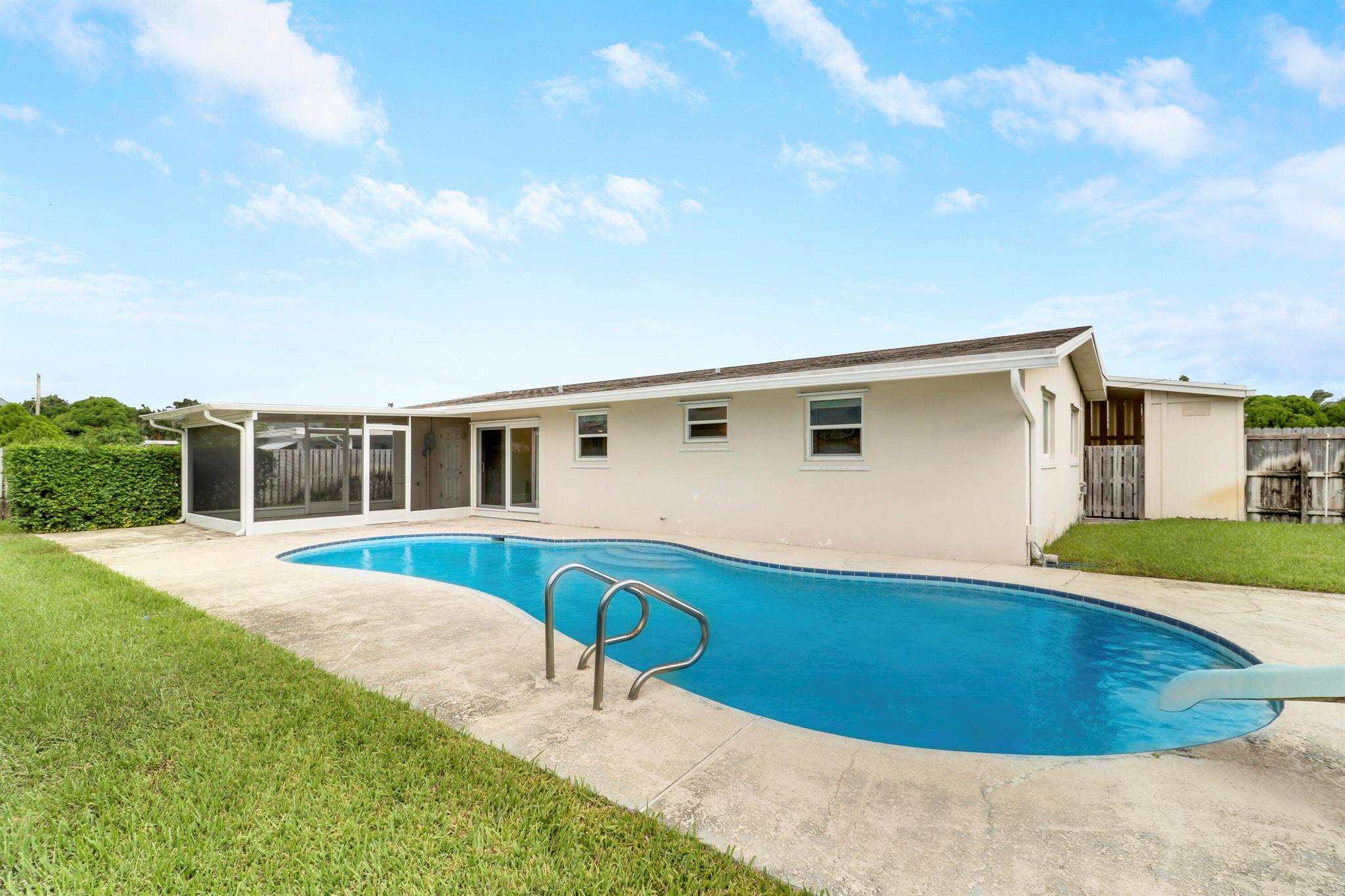 Charming 3-Bedroom Home in Polo Estates Club - West Palm BeachWelcome to this great 3-bedroom, 2-bathroom home in Polo Estates Club. With 1,250 sq. ft. of living space (1,608 total sq. ft.) and a spacious 8,407 sq. ft. lot, this home offers a private pool, large front and back yards, and a carport with an outdoor storage shed. Inside, you'll find bamboo floors in all bedrooms, stainless steel appliances, and recent updates, including a newer A/C, pool pump, hot water heater, and impact windows/sliders. A spacious laundry room leads to a screened-in porch/sunroom overlooking the pool. A well-maintained home in a prime location--don't miss out!
