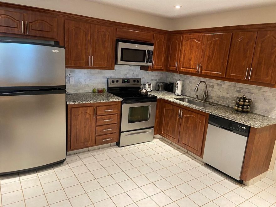 LARGE CORNER 3 BEDROOM 2 BATH UNIT HAS THE FEEL OF A PRIVATE HOME. LARGEST UNIT IN COMPLEX WITH ALMOST 1800 SQ. FT. OF LIVING SPACE.  VERY BRIGHT, LOTS OF WINDOWS. 3RD BEDROOM CAN BE DEN/BEDROOM.  GORGEOUS LAKE  & GOLF COURSE VIEWS.  HURRICANE IMPACT WINDOWS ON 3 SIDES AND WINDOWS FACING LAKE AND PATIO HAVE ACCORDION HURRICANE SHUTTERS.  LARGE EAT IN KITCHEN TOTALLY REMODELED WITH STAINLESS STEEL APPLIANCES,  GRANITE COUNTERS AND CHERRY WOOD CABINETS.  MASTER BATH AND DRESSING AREA ALSO UPGRADED WITH GRANITE COUNTERS, NEW CABINETRY, NEW SHOWER AND NEW TILE.  HI-HATS INSTALLED IN VAULTED CEILINGS.  PLANTATION SHUTTERS ON PATIO DOORS.  BRAND NEW FULL SIZE WASHING MACHINE IN LARGE LAUNDRY ROOM.  SOME FURNITURE CAN REMAIN.  EXCELLENT SCHOOLS.  CLOSE TO SHOPPING.  2 SMALL PETS PERMITTED.