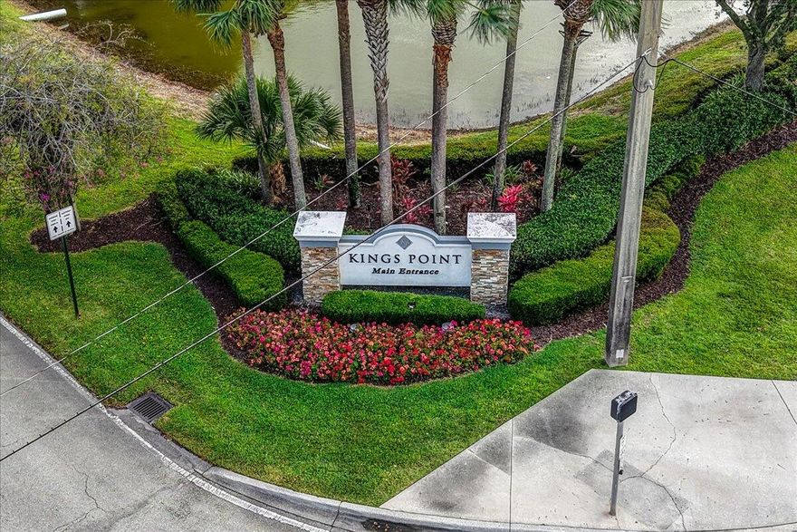 Direct waterfront villa in Kings Point's Valencia section with rare wide-lake views from a glass-enclosed Florida room with accordion hurricane shutters. In-unit washer/dryer. Zone X, no flood insurance required. Resort-style 55+ living: golf, pools, clubhouse, tennis, fitness, theater, 24/7 gated security. Minutes to Atlantic Ave, the beach, and Delray Medical. Move-in ready and rarely available with this view.