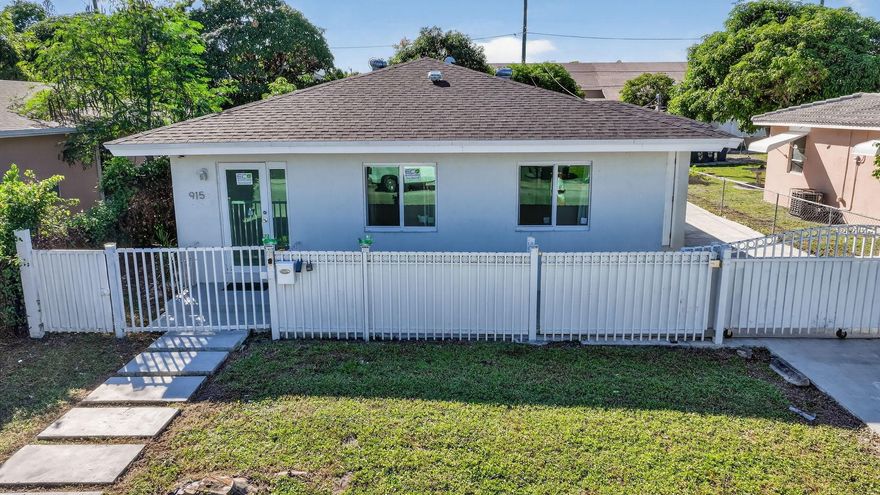Welcome to this charming and beautifully maintained 3-bedroom, 2-bath home located in the heart of Lake Worth Beach! This move-in ready residence offers 956 sq ft of comfortable living space, featuring a bright open layout, ceramic tile flooring throughout, and impact glass windows for peace of mind. The kitchen is equipped with modern appliances including a range, refrigerator, dishwasher, and washer/dryer. Enjoy the spacious master bedroom conveniently situated on the main level and relax outdoors on the covered patio within your fenced backyard. Ample parking is available with a driveway, street parking, and space for multiple vehicles. Perfectly situated west of US-1 and just minutes from downtown, shopping, dining, and the beautiful Lake