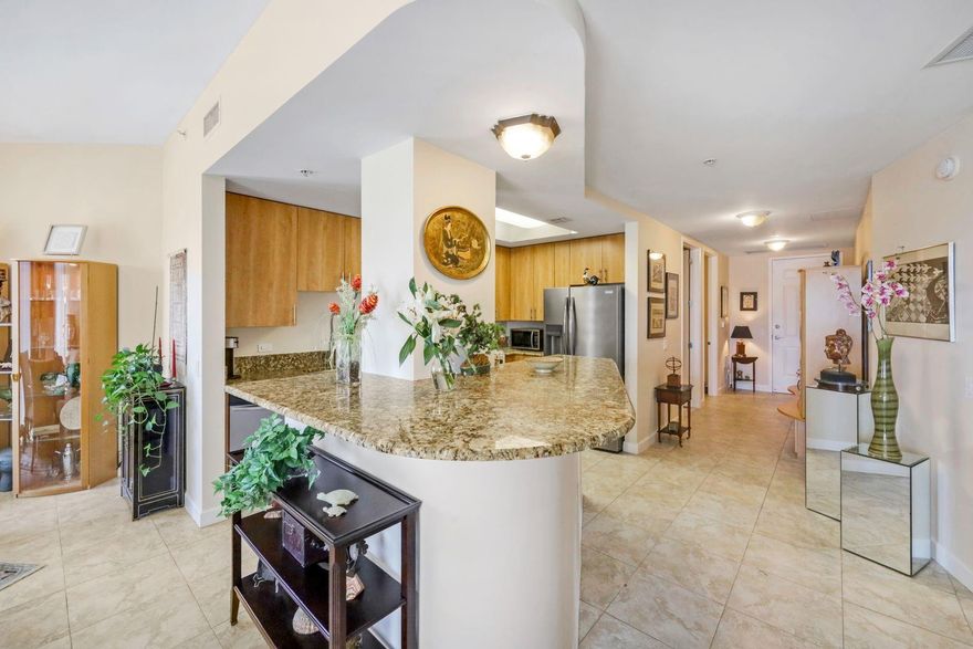 Experience elevated living at Wilton Station, a premier gated community in the heart of Wilton Manors. Enjoy resort-style amenities including an expansive pool, fitness center, private theater & clubhouse. This light-filled end-corner unit offers over 1,500 SF with 2 ensuite bedrooms, 2.5 baths, a large laundry room & 3 private balconies perfect for morning coffee or evening cocktails. The open kitchen features 42" cabinets & granite counters flowing into spacious living & dining areas. Priced below market comps, this home offers excellent remodeling potential—or keep its traditional charm—both options fit your vision in one of Wilton Manors’ most desirable communities!