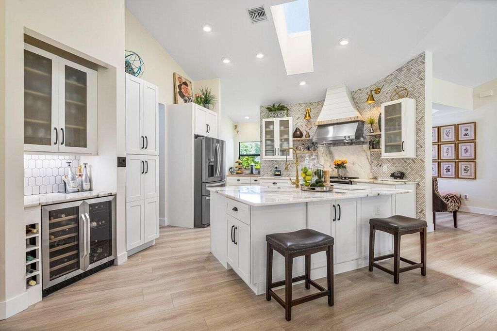 Photo of 2460 Seven Oaks Lane, Palm Beach Gardens, FL 33410 (MLS # R10926238)