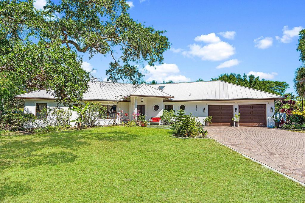 Photo of 2460 Seven Oaks Lane, Palm Beach Gardens, FL 33410 (MLS # R10926238)