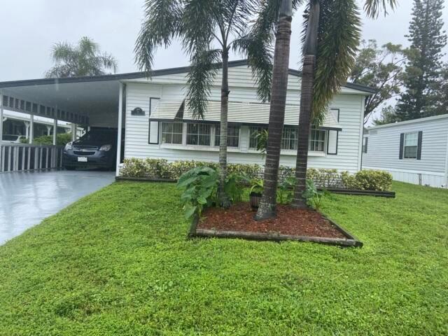 This home is located on a quiet cul de sac with a lake at the end of the street. Spacious 2 bedroom 2 full baths has lots of room for you! There is an attached shed with access from the large screen room and exit to the nicely landscaped lot. Upon entry to the large bonus room (currently used as the home office) you can pass through the kitchen or living area! The Galley kitchen has 2 year old new stainless appliances and leads to the dining area with built in china for more storage. Just down the hall is an indoor laundry with new washer and dryer (2 year new). The bedrooms are stacked in the back of the home with 2 full baths. The current home owner will leave the guest room furnishings as well as small sofa and end tables, and a table and 4 chairs in the screened room.