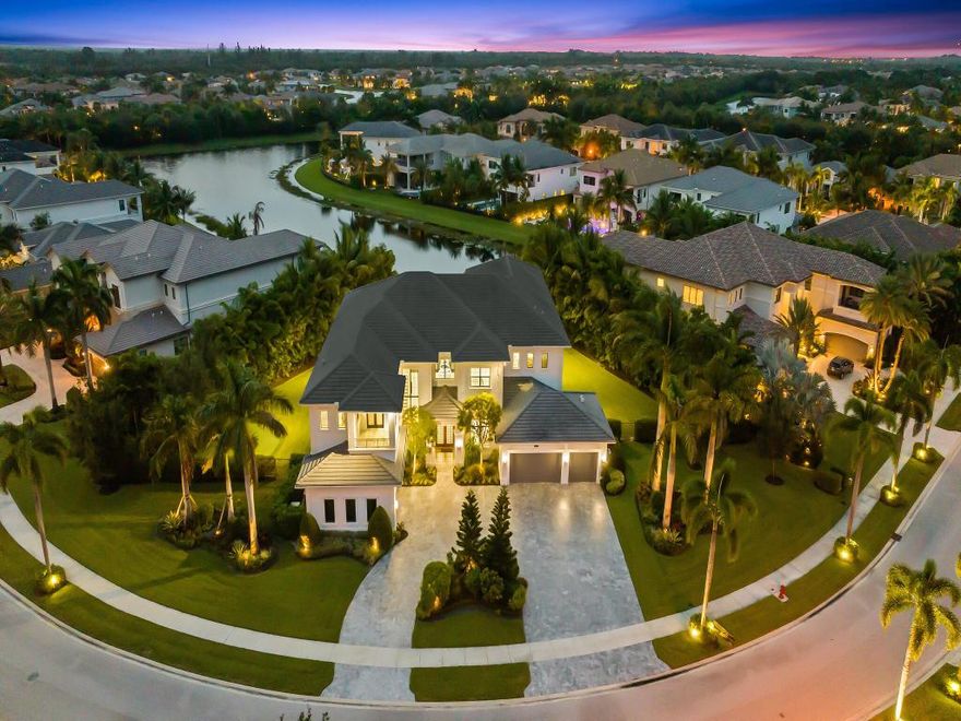 This Special Expanded Vanderbilt Grande model is Lakefront, on a 3/4 Acre 'double' lot!! Offering 6 bedrooms, plus loft, office, media room, 8 full & 2 half baths, 2 laundry rooms, 5 car garage, the estate style home totals 11,567 sq ft (8,017 under air) surrounded by wide lake views and lush, treed, mature and newly planted garden vistas. Retreat outdoors with all the comforts of home using telescoping impact doorwalls off living room, to exterior dining space & summer kitchen. Optional motorized privacy screens compliment the space.  Enjoy fabulous sunsets from sprawling patio & balconies, salt water pool & spa with heater/chiller, private putting green, fenced green space for playground or dog run.
Home Upgraded throughout. Indoor elevator. Home generator. Water filtration. EV charger Whole home water filtration.