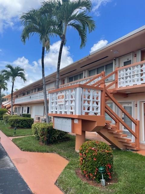 Delightful and affordable one bedroom one bath second floor unit with front door and rear door access. Excellent opportunity for relaxed Florida year-round or vacation living. Enjoy the refreshing pool, club house, gym and serene lake. Property is conveniently close to beaches, Gulf Stream Casino, and shopping. Don't miss this one!