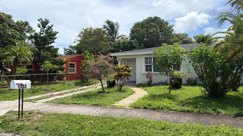 Photo of 1302 S H Street, Lake Worth Beach, FL 33460 (MLS # B26065610)