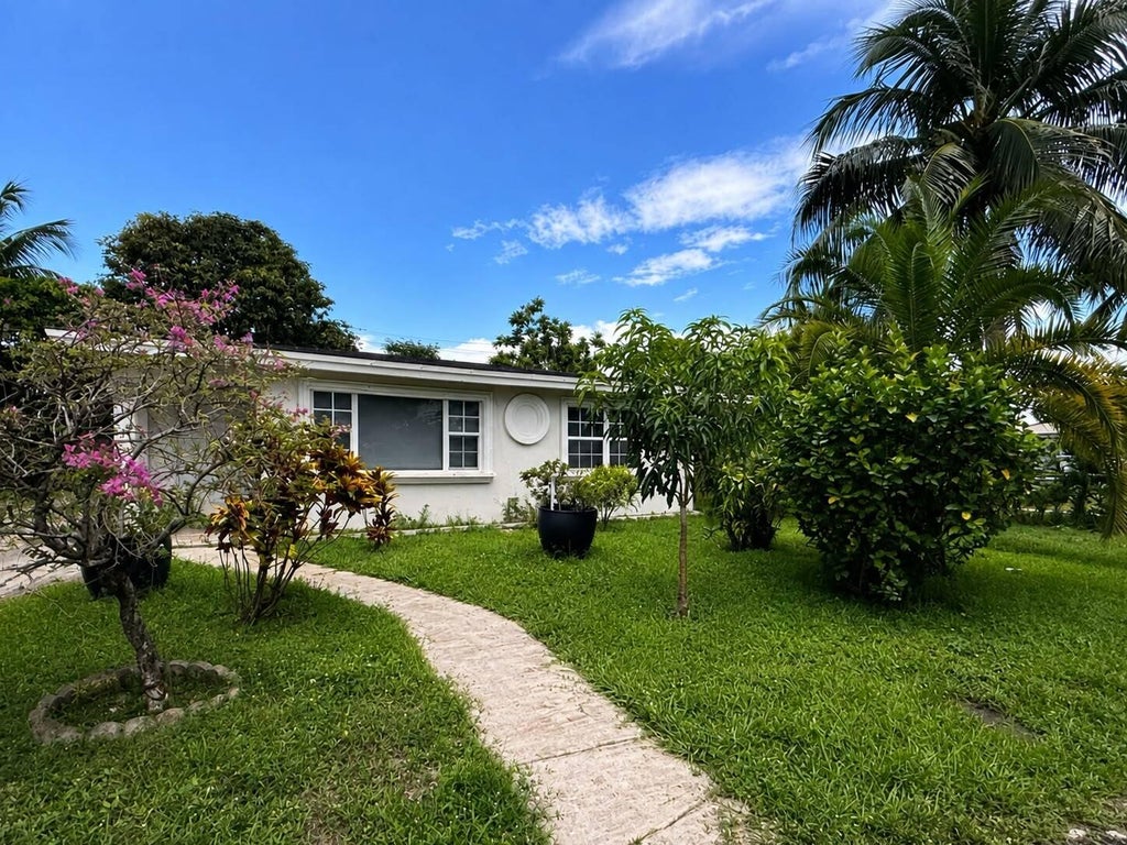 Photo of 1302 S H Street, Lake Worth Beach, FL 33460 (MLS # B26065610)