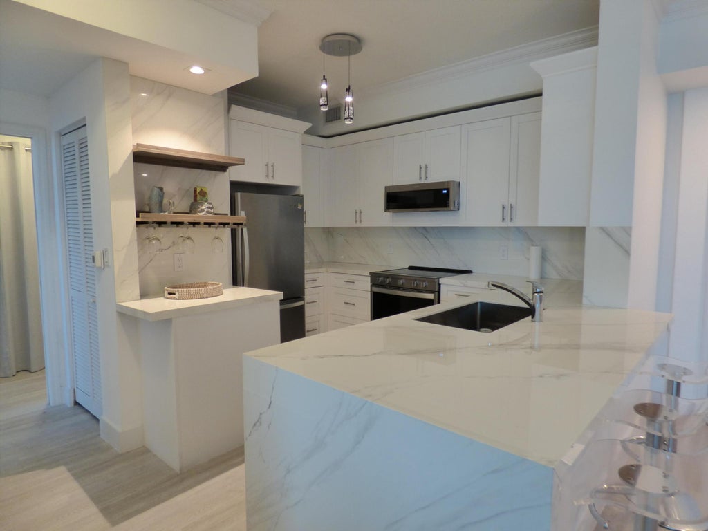 Photo of 802 W WINDWARD Way #303, Lantana, FL 33462 (MLS # B26063106)