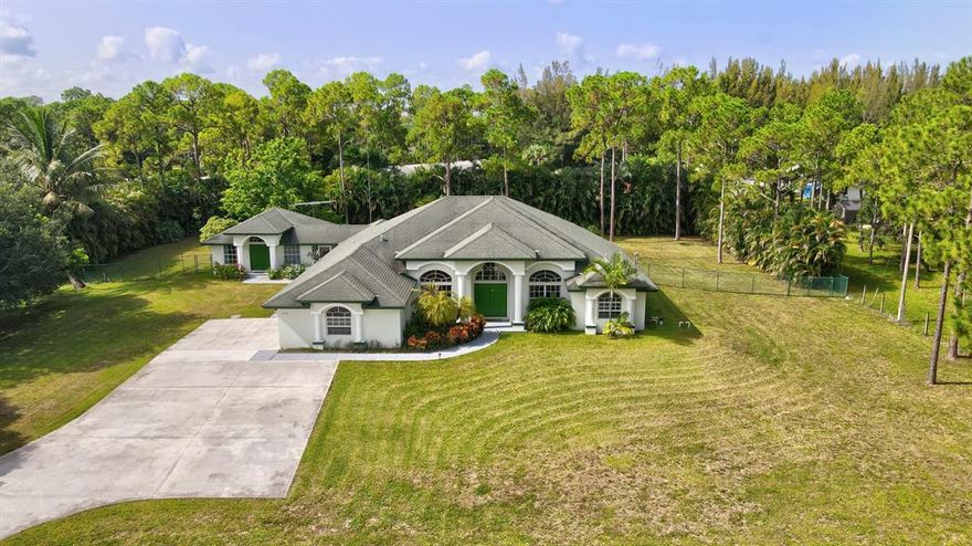 The main house of this beautiful and specious home has Four bedrooms, 3 full Bathrooms, Den, separate Dining area, Family Room & Several Living areas, A large Open concept Kitchen, Laundry Room and 2 Car Garage. An Extensive Pool, with a Jacuzzi, Tiki Hut and Huge Fenced Backyard, Make Life Feel Like a Permanent Vacation. 
The Guest house has Living Area, full kitchen with breakfast area, one extremely large Bedroom with Walk-in closet and Full Bathroom. 
A tranquil screened-in Patio connects the main house and the Guest house, though both homes have separate entrances as well.  
Multiple sets of French doors and plenty of windows allow lots of sunlight and gives the feeling of openness and brightness. Wake up in a luxurious, recently renovated Master Suite overlooking the Pool & Garden Eat from your own fruit trees and experience the calmness and joyful feeling of having the kind of privacy only one of the largest lot (1.37 Acre) around can give, while located just minutes from the local stores and parks.

Home Improvements 

Within the last 6 months- 
* Guest house a/c 
* Pool pump 
* Pool lights
* Blinds guest room 

Within past 1 yr- 
* Frameless shower- master bath 
* Large wall mirror master bath 
* Custom shutters master bath
* Hot water heater- main house 
* Baseboards and paint main house 

Within 3 yrs- 
* New AC unit main house ( 5 ton) 
* Entended concrete driveway 
* New Washer/Dryer 

Within 5 yrs- 
* New Bosch Dishwasher
* Laminate Flooring - guest bedroom
* New Paint - guest house
* Tile in master bedroom
* Extended patio and installed pavers- patio 
* Tiki hut 

The home also has an easy-maintenance Well Water Filtration System