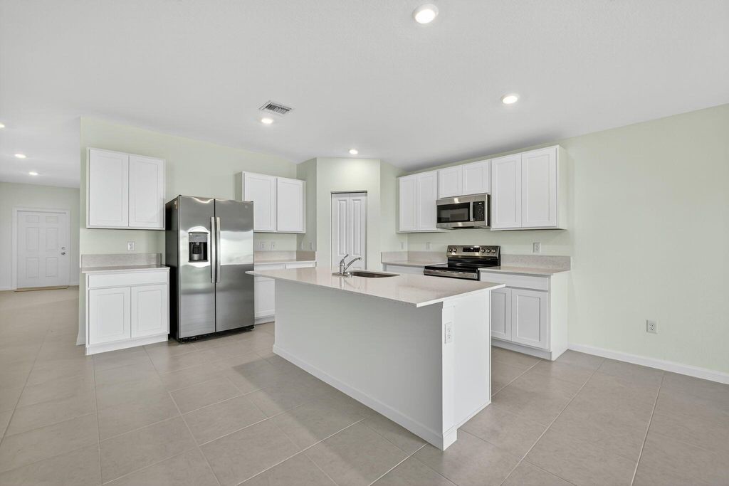 Photo of 728 Carlyle Way E, Fort Pierce, FL 34947 (MLS # R11119231)