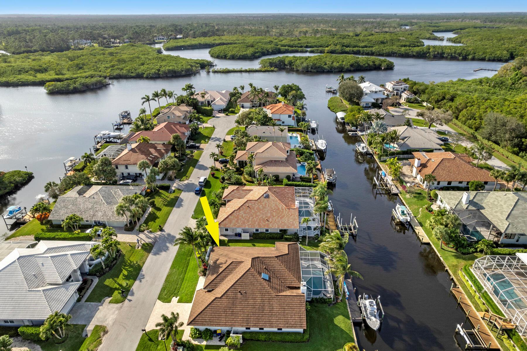 Fully renovated Riverfront home in Tequesta with 10,000lb boat lift! Access to Jupiter Inlet, sandbars, and dining. This beautiful home features high ceilings, an updated kitchen with Thermador appliances and bar area with a wine fridge. Large master suite with oversized walk-in closet and updated master bath. Two additional bedrooms share a newly renovated bath. Large patio and refinished pool with outdoor summer kitchen. Fire Magic grill and sink. Waterfront deck alongside the seawall. Impact windows and doors. Fresh paint inside and out. New plantation shutters. Surround sound. Wood burning fireplace. New travertine driveway, landscaping and lighting. Epoxy garage floor and built-in cabinets. North Passage is a gated community with a clubhouse, pool, gym, tennis courts and playground.