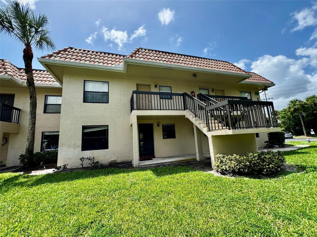 Photo of 6820 PALMETTO CIRCLE S Bldg 10 #103, Boca Raton, FL 33433 (MLS # F10523412)