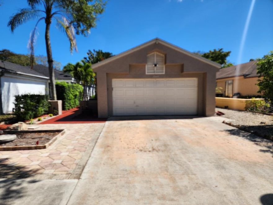 Welcome to this beautifully maintained and impeccably clean 3-bedroom, 2-bathroom rental home, perfectly situated within a desirable 24-hour guard-gated community. From the moment you arrive, you'll appreciate the sense of security, comfort, and pride of ownership this home offers.  Step inside to discover a spacious and thoughtfully designed layout featuring both a formal living room and a separate family room—ideal for entertaining guests or enjoying quiet evenings at home. The upgraded kitchen is a standout, offering abundant cabinet space, modern finishes, and plenty of room to prepare and enjoy meals.  Elegant 18-inch porcelain tile flooring for style and durability, along with hurricane-impact windows and sliding glass doors. Welcome to this beautifully maintained and impeccably clean 3-bedroom, 2-bathroom rental home, perfectly situated within a desirable 24-hour guard-gated community. From the moment you arrive, you'll appreciate the sense of security, comfort, and pride of ownership this home offers.  Step inside to discover a spacious and thoughtfully designed layout featuring both a formal living room and a separate family room—ideal for entertaining guests or enjoying quiet evenings at home. The upgraded kitchen is a standout, offering abundant cabinet space, modern finishes, and plenty of room to prepare and enjoy meals.  Throughout the home, you'll find elegant 18-inch porcelain tile flooring, providing both style and durability, along with hurricane-impact windows and sliding glass doors for added peace of mind.  The outdoor space is truly a private oasis. Relax or entertain on the open paved patio, surrounded by lush, well-maintained landscaping that creates a serene and inviting atmosphere.  As part of this vibrant community, residents enjoy access to an array of amenities, including a sparkling swimming pool, fully equipped fitness center, basketball court, clubhouse, and more—enhancing your lifestyle with convenience and recreation right at your doorstep.  This home offers the perfect blend of comfort, style, and community living—an exceptional rental opportunity you don't want to miss.