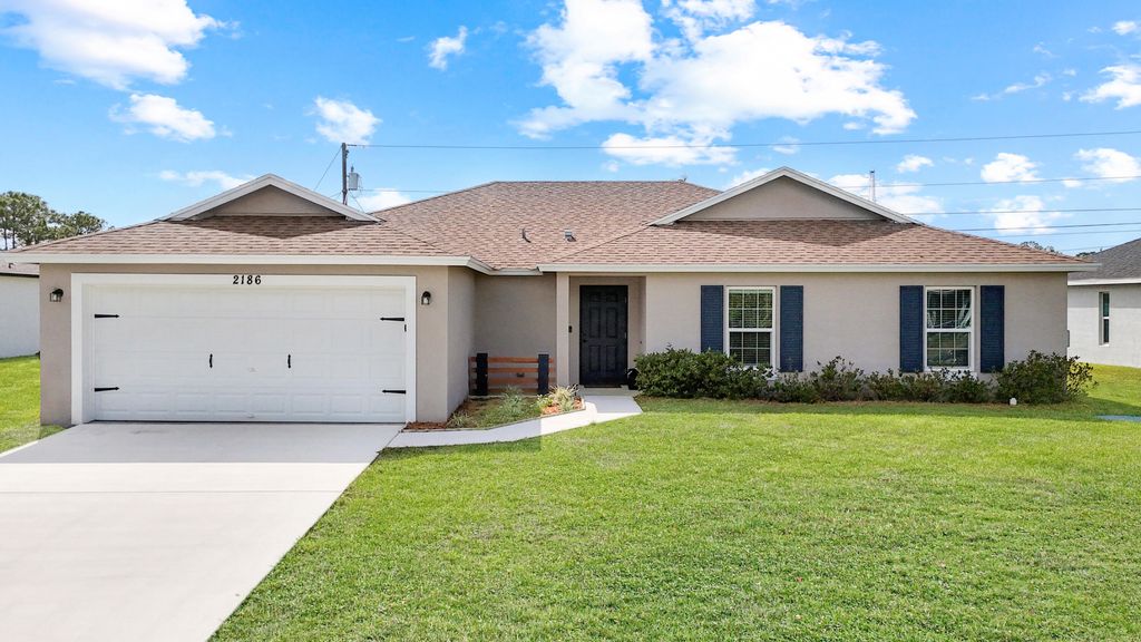 Photo of 2186 SW Imperial Street, Port Saint Lucie, FL 34987 (MLS # B26010354)