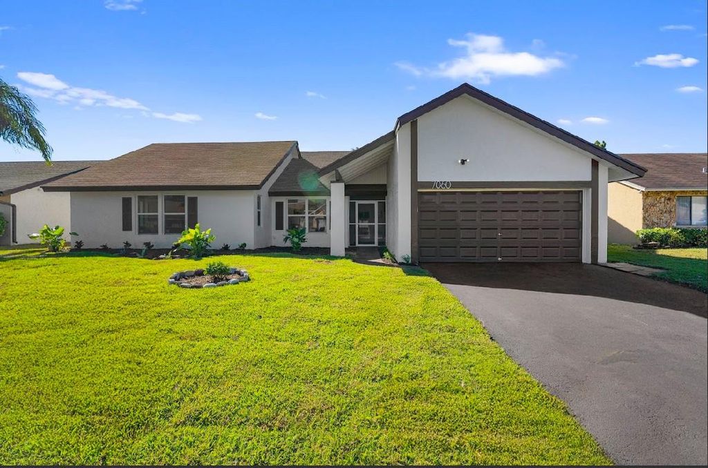 Photo of 7060 NW 47th Place, Lauderhill, FL 33319 (MLS # F10549796)