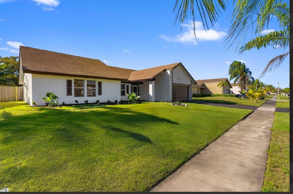 Photo of 7060 NW 47th Place, Lauderhill, FL 33319 (MLS # F10549796)