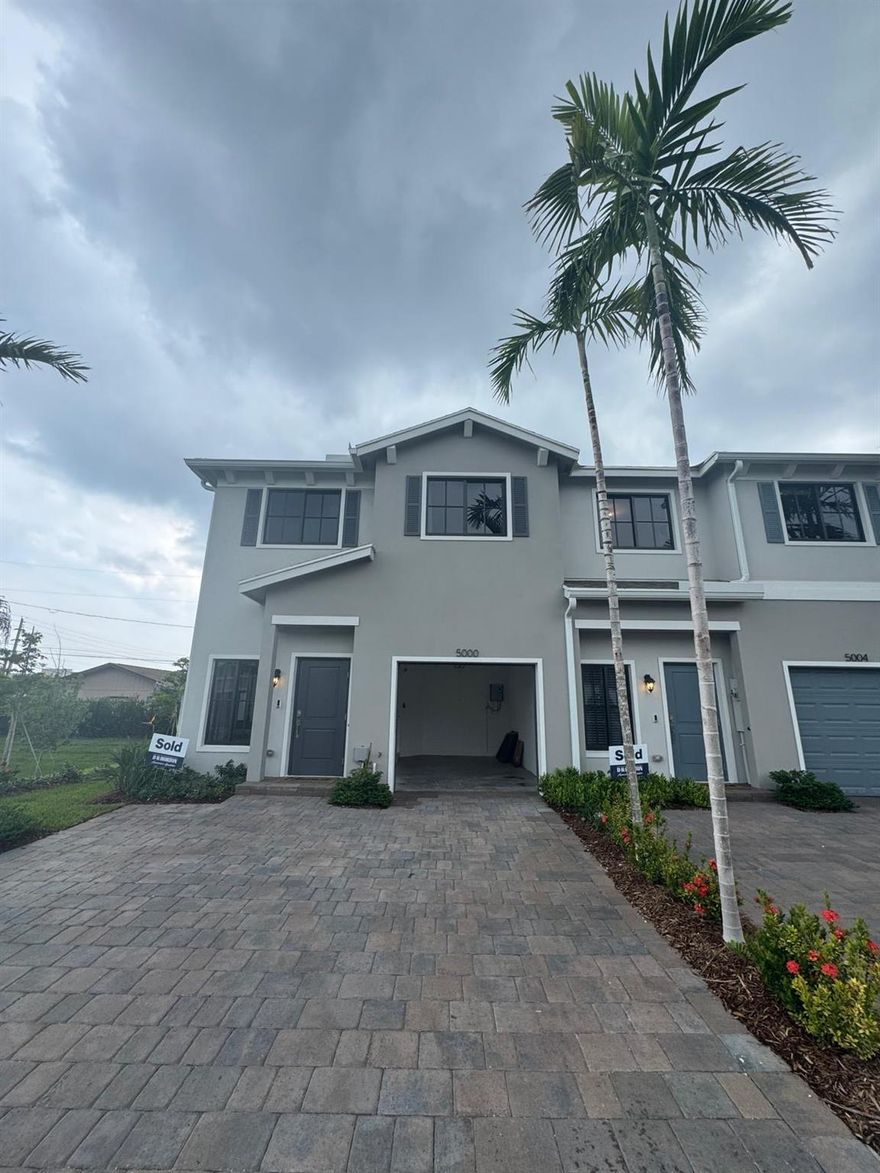 UPGRARDED Brand New CORNER Lot  Model Home .Be the first one to live in this beautiful townhome in a boutique collection of 40 Tradition Series townhomes the heart of Palm Beach. This Unit offers Stainless Steel Whirlpool Appliances with 36'' Upper Wood Color Flagstone Cabinets, Quartz Kitchen Countertops with a square edge and 4'' backsplash--it includes SS undermount sink & chrome faucet. The Main Floor Tile comes with 24 x 24 Porcelain tiles, Mohawk Carpet on stairs and 2nd floor, Marble White Countertops, laundry room on 1st floor, large walk-in closets, and tankless water heater. The home is professionally landscaped, equipped with smart home technology featuring smart lighting. Easy access to most major highways ,Downtown West Palm Peach Palm Beach Airport , Outlets and Beach