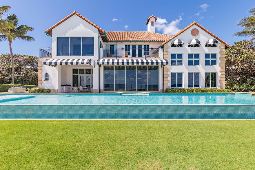 Spectacular seaside paradise recently renovated. Ocean-to-Lake estate with almost 400 feet of depth allowing expansive outdoor space and privacy. Sprawling 150 feet +/- of beach frontage with an infinity pool overlooking the Atlantic Ocean. Breathtaking gardens with outdoor water features, dining area, and oceanfront loggia. This one-of-a-kind custom estate includes 5 bedrooms, 6 full and 1 half bathrooms along with a guest house including full kitchen. An entertainer's dream complete with open living areas, home theater, billiards room, artificial turf with 18-hole golf and tennis court Not only is the residence an incredible offering, but the land and location are second to none.