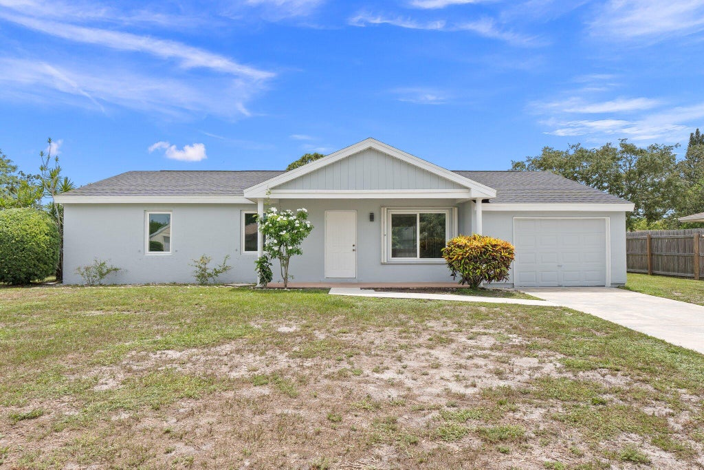 Photo of 1742 SE Burgundy Lane, Port Saint Lucie, FL 34952 (MLS # R11003745)