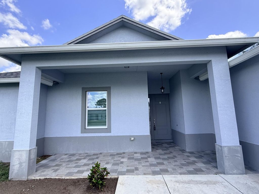 Photo of 5673 NW Whitecap Road, Port Saint Lucie, FL 34986 (MLS # B26041645)