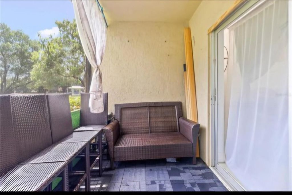 Photo of 5961 N Falls Circle Drive #103, Lauderhill, FL 33319 (MLS # F10481072)