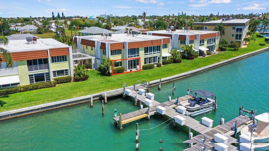 Welcome to the 55+ community of the Colonnades. Exceptional value for this first floor, corner, waterfront condo w/ beautiful views of Faber Cove on South Hutchinson Island! Boat slips available for owners to rent at reasonable rates - a reason in and of itself to buy this beautiful home, not to mention an easy boat ride to the inlet! Not uncommon to see manatee & dolphin right out your window. No steps, tile/vinyl thru-out, open floorplan, updated kitchen and bath, enclosed sunroom, & outside patio. Reasonable COA fees. Short walk to the beach & lots of great tiki bars/restaurants. Colonnades offers an Olympic size pool, sauna, tennis/pickleball, bocce ball, shuffleboard, fitness center, clubhouse, billiards room, and storage options for your RV, boat, or trailer. 90 day minimum rental.