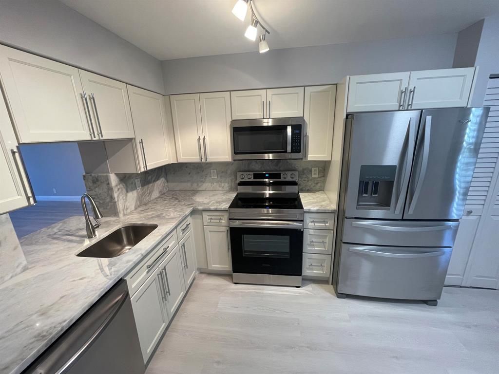 Photo of 7260 Kinghurst Drive #104, Delray Beach, FL 33446 (MLS # R10880803)