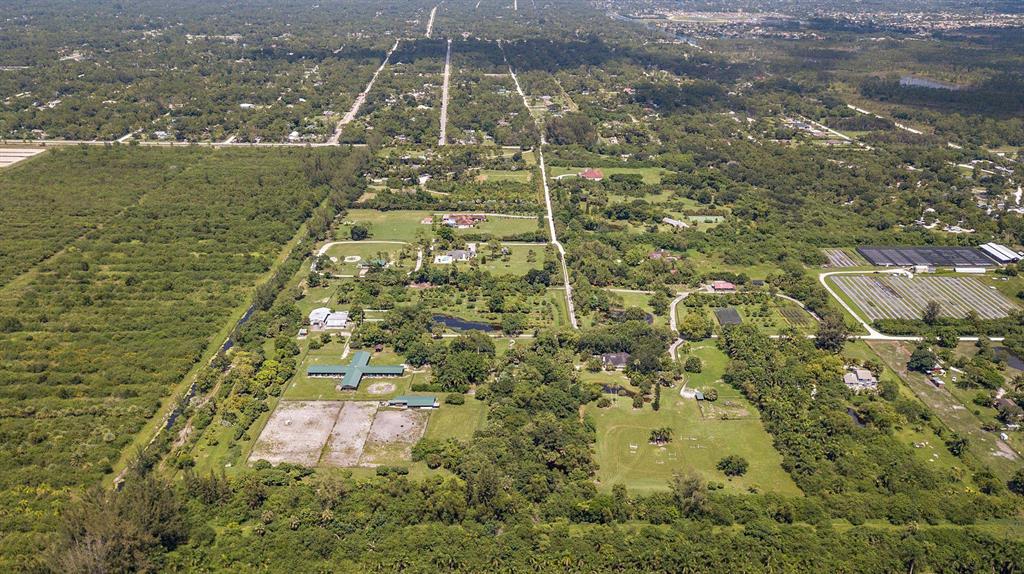 The Stables at Little Turtle Creek is a unique 25-acre property offers an Old Florida-style sanctuary that cannot be found elsewhere. Five ponds; three barns; fenced paddocks; groves of mangos, lychee and starfruit; a wooden bridge, and a treehouse offer peaceful adventure to select buyers. Included:MAIN HOUSE 3 BR/ 2.5 BA including attached MOTHER-IN-LAW apartment.WEEKEND Cottage which fronts a small lakeMANAGER's Quarters on Fruit GroveGUEST COTTAGE 3BR40 STALL HORSE BARN