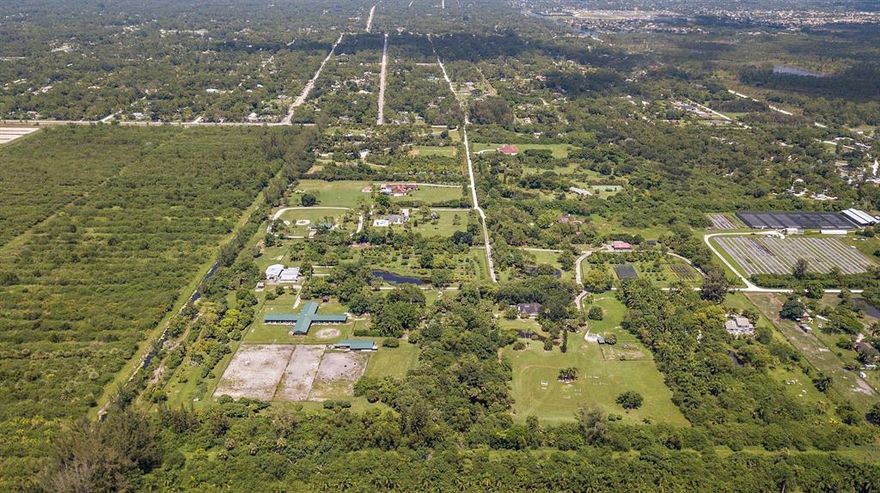 The Stables at Little Turtle Creek is a unique 25-acre property offers an Old Florida-style sanctuary that cannot be found elsewhere. Five ponds; three barns; fenced paddocks; groves of mangos, lychee and starfruit; a wooden bridge, and a treehouse offer peaceful adventure to select buyers. Included:

MAIN HOUSE 3 BR/ 2.5 BA including attached MOTHER-IN-LAW apartment.

WEEKEND Cottage which fronts a small lake

MANAGER's Quarters on Fruit Grove

GUEST COTTAGE 3BR

40 STALL HORSE BARN