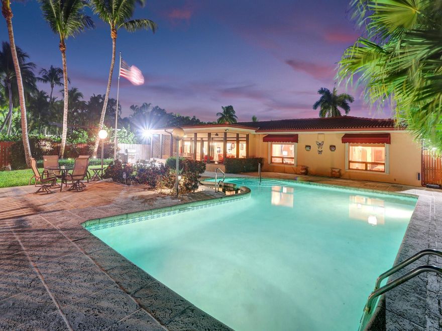 Exciting and rare opportunity to own this waterfront home on one of the best lots in Normandy Isles. The property boasts stunning views of downtown Miami and the Intracoastal Waterway. This is truly a boater’s paradise with over 80 feet of waterfront on a huge open section of Miami Beach waterfront. This 4 bedroom, 3 bath “Old Florida” home comes with a 30,000 lb. boat lift and one of the largest docks in the area measuring 12ft wide by 40ft long. This home is ready to entertain with a covered patio, in-ground pool and hot tub. Electric shutters and a standby Generac generator have been installed for your convenience. Bring your boat and come enjoy what Miami Beach has to offer. This home is move-in ready or build your dream home on this truly amazing lot.