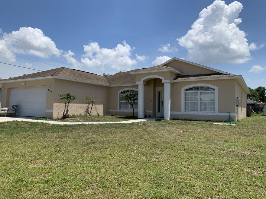 3/2/2 CBS home located in a desirable location close to schools, shopping, I95, turnpike, hospitals, and local beaches.  The home features tile and laminate flooring throughout, volume ceilings, a large, screened lanai, separate living room, family room, and formal dining room.  Schedule your private showing today.