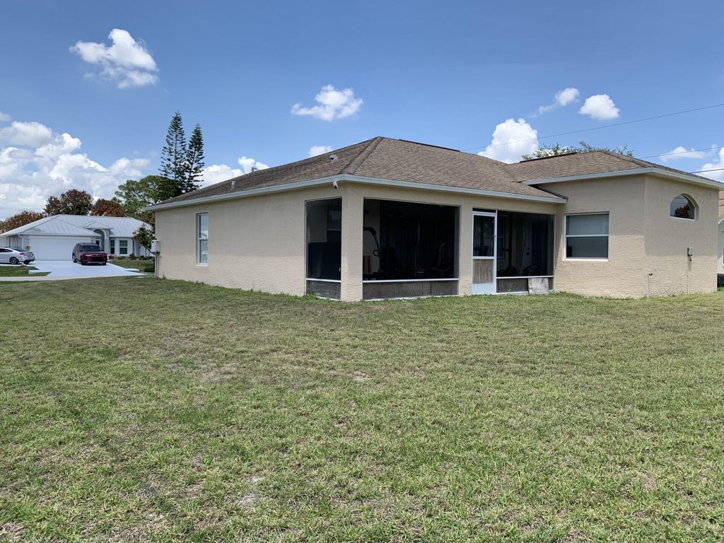Photo of 892 SW Duncan Terrace, Port Saint Lucie, FL 34953 (MLS # B26021083)