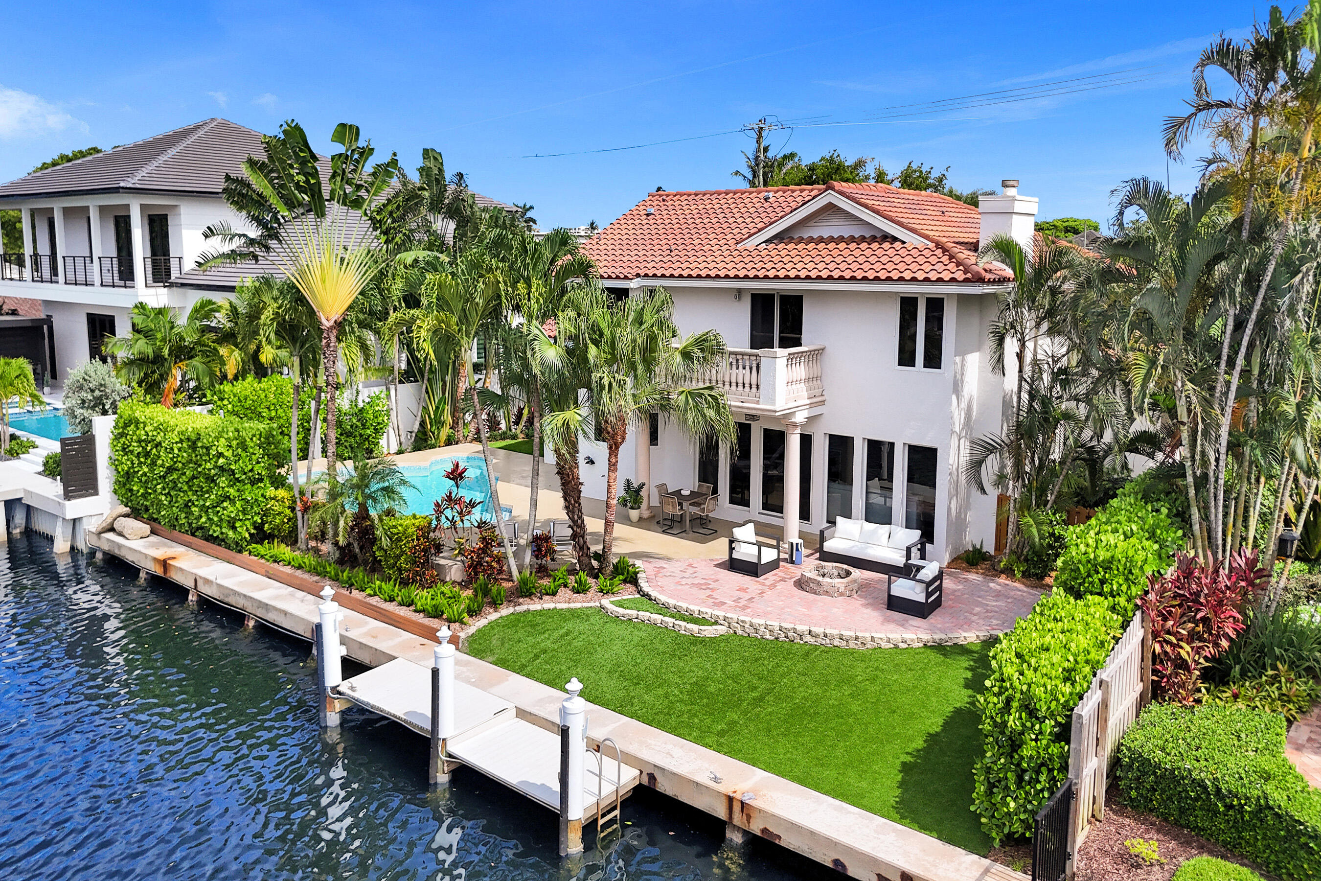 This is the waterfront home you have been waiting for! Bring your boat and dock it behind the house. Completely remodeled & Beautiful inside and out! This 4 bedroom, 3 bathroom, 3 car garage home features 90' of waterfront living, amazing high end chef kitchen, Marble floors throughout first floor, Open floor plan, soaring ceilings, Outdoor living at its finest, heated swimming pool, covered patio and open balcony. Just minutes to great shopping, beaches, places of worship, restaurants, and trendy downtown Delray. Bring your boat and dock it behind the house. Ocean access with no fixed bridges.
