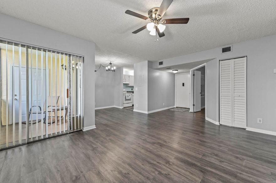 Welcome to Chasewood of Jupiter! This well-maintained 2-story condo features a desirable first-floor corner unit offering 2 bedrooms, 2 bathrooms, and 906 sqft of comfortable living space. Enjoy added protection with accordion shutters and a functional layout designed for everyday living.  The kitchen is equipped with appliances and ample cabinetry for storage, flowing seamlessly into the dining and living areas. Step out to the screened patio, perfect for relaxing or entertaining.   The spacious master suite features large closets, wood-look flooring, and a private ensuite bathroom with a shower. The second bedroom includes its own closet and direct access to a full-size bathroom with a tub/shower combo and in-unit washer and dryer for added convenience.  Don't miss this opportunity to own a charming and practical home in a sought-after community!