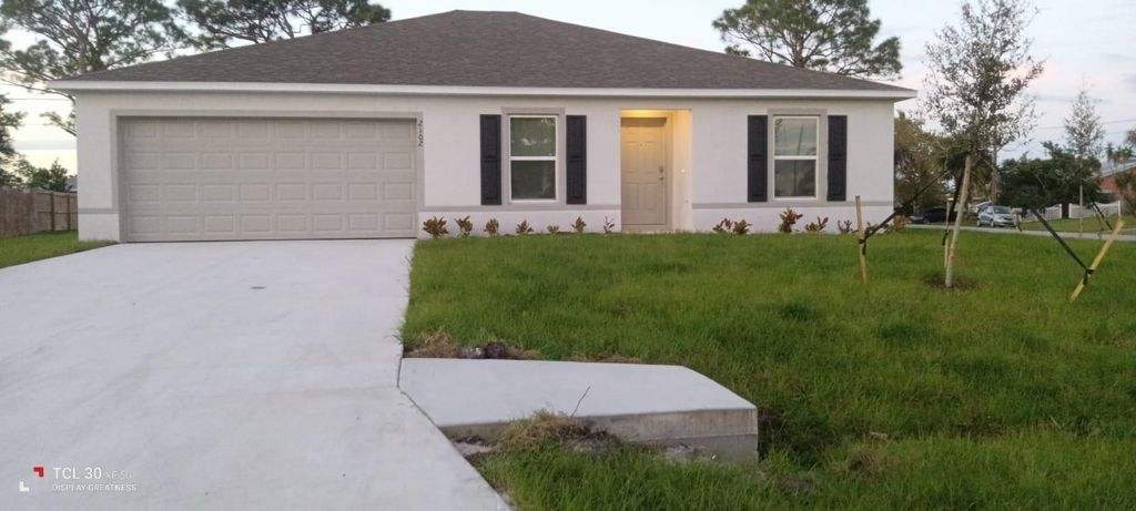 Photo of 2102 SE Holland St, Port Saint Lucie, FL 34952 (MLS # F10526394)