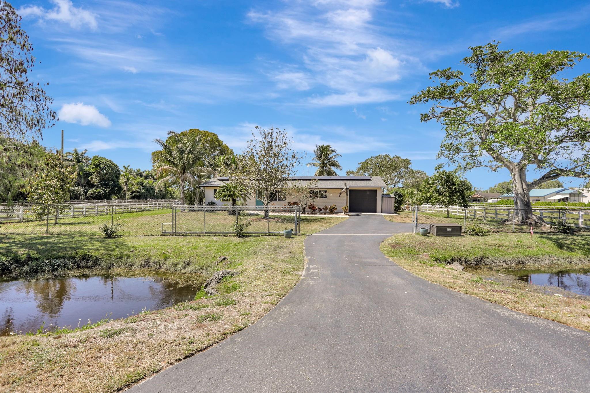Equestrian estate almost 5 Acres sub-dividable with updated 3 bedroom 2 bath ranch with pool and working fireplace Barn is 5600 sq. ft. with 20 stalls and tons of pastures . Bonus chickens never buy eggs again.