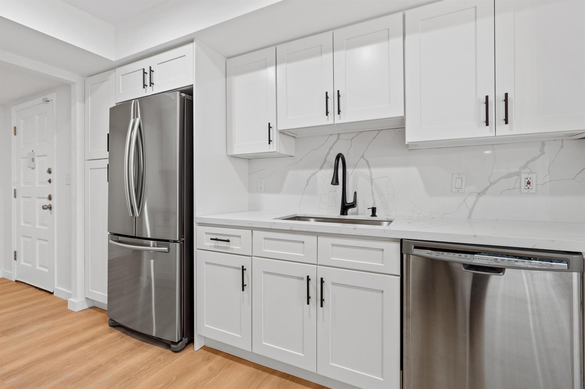 Stunningly renovated, 2 bedroom, 2-full bathroom, first-floor corner unit with spacious screened wrap-around patio with tons of natural light throughout! Sprawling an impressive 1,537 sq.ft. under air, and 1,726 sq.ft. total, this unit is a showstopper! Brand new luxury vinyl plank wood-look floors throughout, new kitchen cabinetry, countertops and backsplash. Stainless appliances. Gorgeous, modern bathrooms with new vanities, fixtures and tile. Lots of storage and closet space. Walk out of your screened patio to the waterfront community-pool and outdoor kitchen/bar with two grills, stunning clubhouse with indoor wet bar, kitchenette, dining table and sofas with TV overlooking the lake with fountains. Pickleball courts and more. Shopping & Dining in walking distance! (PLS SEE SUPPLEMENT)