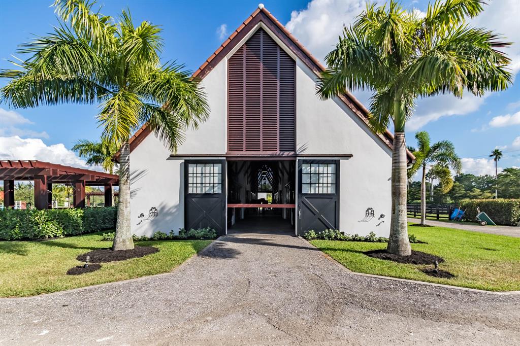 Spectacular barn. Hacking distance from the show grounds you have a barn with 12 12 x 12 stalls available.The barn features , 2 feed room, 2 tack room, rubber isles flooring done for the comfort and care of the horses as well as rubber matt floor stalls., 8 paddocks, outdoor grooming areas , all weather 135 ft x 175 ft aprox. arena built by ESI fully equipped with set of jumps. The barn also has 2 fly spray systems a Lounge for riders, an office space, 2 tack rooms, 2 feed rooms and two full bathrooms.It also counts with a Derby field that is approximately 145 ft x 18