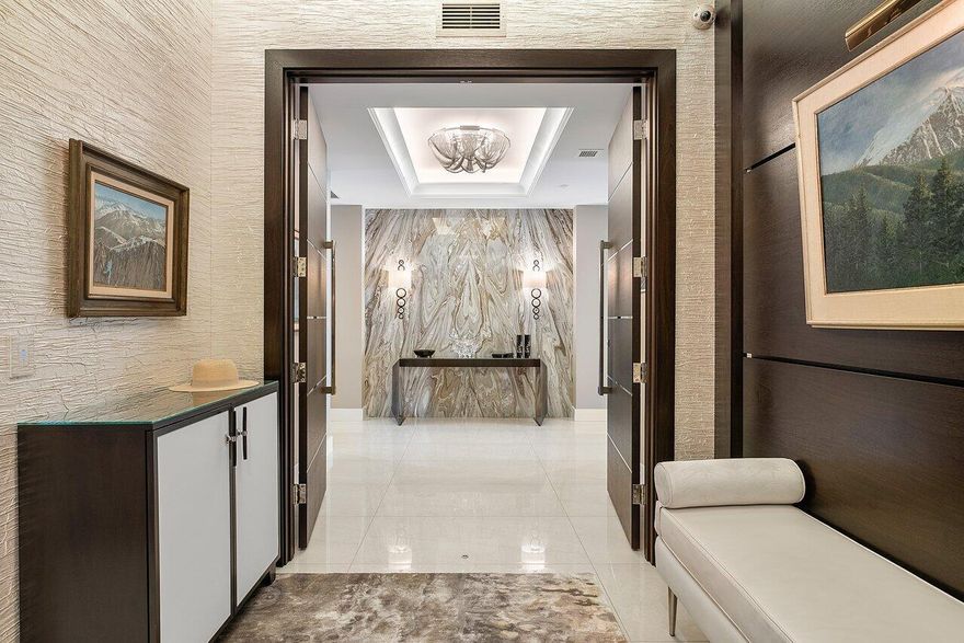 Experience the epitome of luxury living with this stunning residence at 5000 North Ocean. This exceptional home offers a unique blend of elegance and modernity, boasting 3753 living square feet of space and custom-designed finishes. From the moment you step into your private elevator foyer, you'll be greeted by custom wood entry doors, architectural floor-to-ceiling windows, and breathtaking views of the Atlantic Ocean, Intracoastal waterways and MacArthur Beach State Park. The open-concept living space is perfect for entertaining, with a smart home integrated system controlling audio, video, and electric shades throughout.Professionally designed, every detail has been meticulously chosen to create a one-of-a-kind masterpiece.