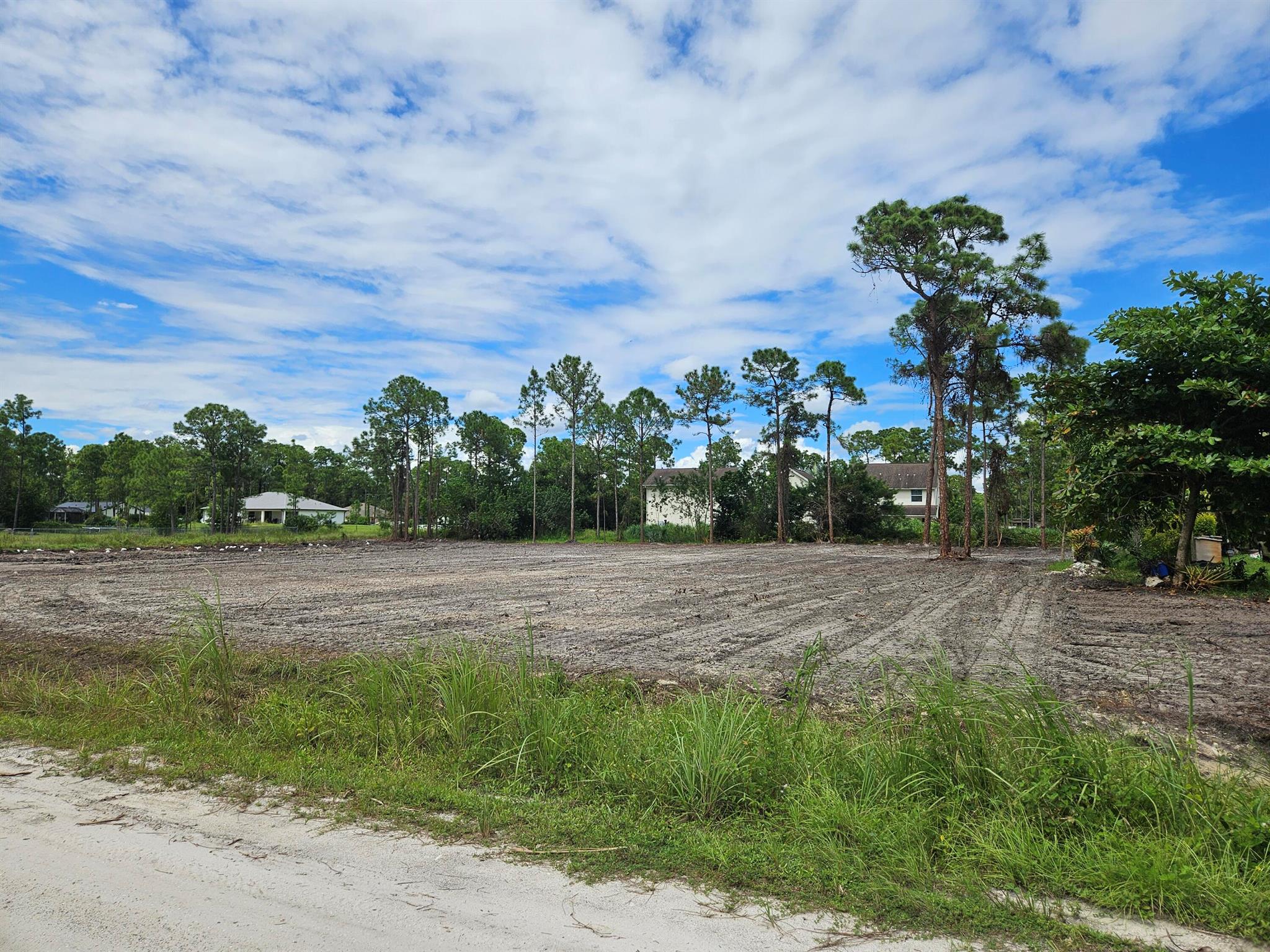 This is a prime high and dry lot in the perfect location to build your custom dream home. This vacant 1.34 acre lot is now available and ready for your designs and plans. This beautiful property has just been fully cleared, saving you time, money and peace of mind. Zoned AR with no HOA, allowing for you to bring your boats, trailers, RVs, horses, chickens, etc. Located 5-10 mins from Westlake and 10 mins to the new Avenir area. Lots of new construction and infrastructure improvements taking place in the surrounding area. Preliminary Soil Test and Survey available upon request. Preliminary soil testing shows no organic materials and soils suitable for a shallow foundation. Located directly next to the canal which aides with drainage.
