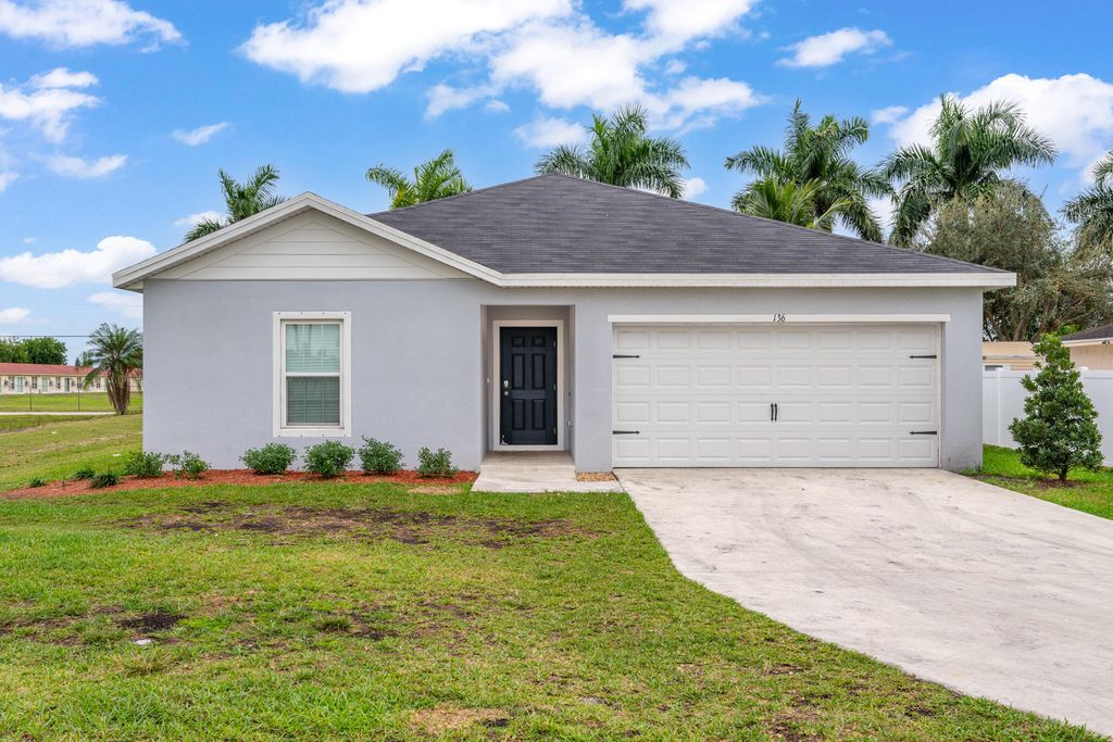 Photo of 136 Dabou Loop, Belle Glade, FL 33430 (MLS # R11146692)