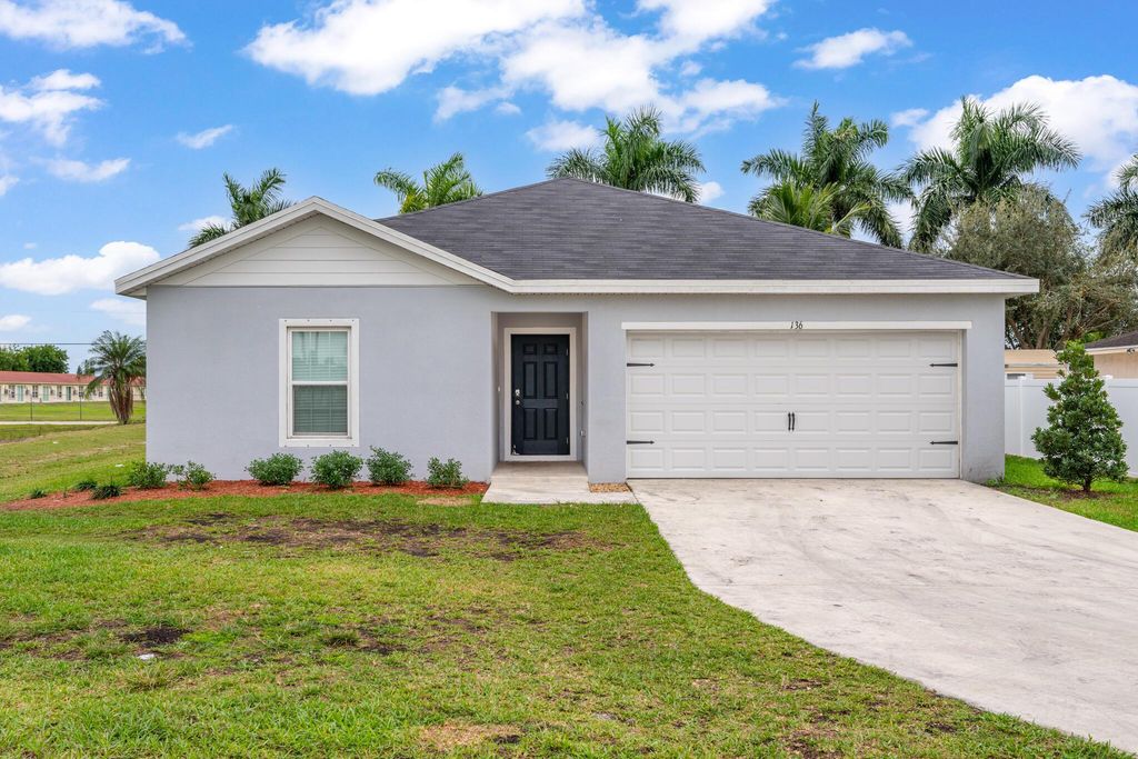 Photo of 136 Dabou Loop, Belle Glade, FL 33430 (MLS # R11146692)