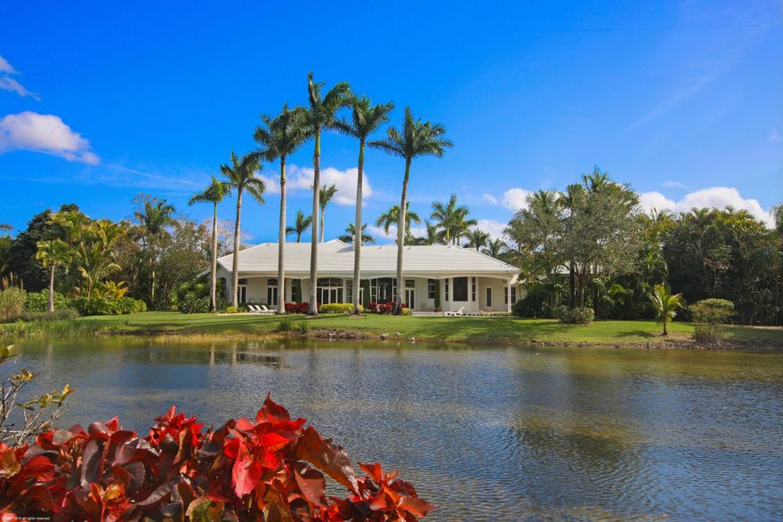 6.42 acre grande estate fenced and gated,  featuring a long driveway, and expansive porte- cochere, private tennis court and 1 acre lake.  Palm beach inspired decor with plenty of natural light, newer roof, all marble and wood floors, chefs kitchen with center island, 2-sided fireplace,  6 bedrooms and 6.5 baths plus library.  Beautiful gazebo with summer kitchen overlooking the lake and pool.  Enormous master suite with exercise room,  reading room, and sauna, all overlooking the tranquil lake and private grounds.