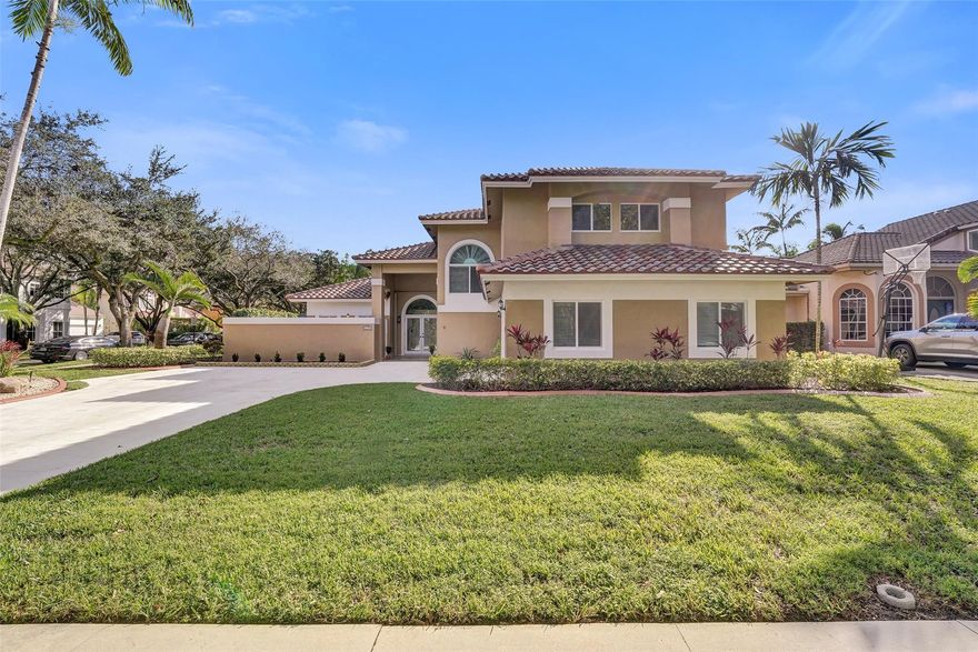 This 5-bedroom, 3.5-bath two-story home offers approximately 3,506 SF of thoughtfully designed living space with the kind of layout buyers actively search for: a first-floor bedroom with an ensuite bath—perfect for guests, multigenerational living, or a private home office—plus generous formal and casual areas that flow beautifully for everyday life and entertaining. The standout feature? A brand-new roof, giving you immediate peace of mind and long-term value. Add in impact windows + accordion shutters, a hurricane-rated garage door, and a generator hookup, and you’ve got a home built for comfort and storm-ready confidence. Major systems are already on your side with A/C, approx. 3 years, dryer approx. 1 year, and a nearly new washer. Outside, the home sits on a fenced corner lot with an oversized driveway and a 2-car garage, offering the space and flexibility today’s buyers want—room for multiple vehicles and toys, plus easy guest parking. An electronic sprinkler system helps maintain strong curb appeal with minimal effort.Inside, enjoy a bright, open atmosphere with volume ceilings and multiple living zones—ideal for busy households that want room to spread out without sacrificing connection. Upstairs, the primary suite is a true retreat, with two walk-in closets and a balcony, creating a private place to recharge at the end of the day.And the location is the lifestyle: Rock Creek is beloved for its walkable streets, parks, and community energy—just minutes to top Cooper City parks and sports complexes, shopping, dining, and commuter routes. Residents also enjoy the Cooper City Pool & Tennis Center within the community and a calendar of family-friendly city events year-round. Plus, you’re zoned for highly regarded Cooper City schools (buyer to verify current assignments).Move-in ready, storm-smart, and located where people want to live—this is the one you’ve been waiting for in Rock Creek.