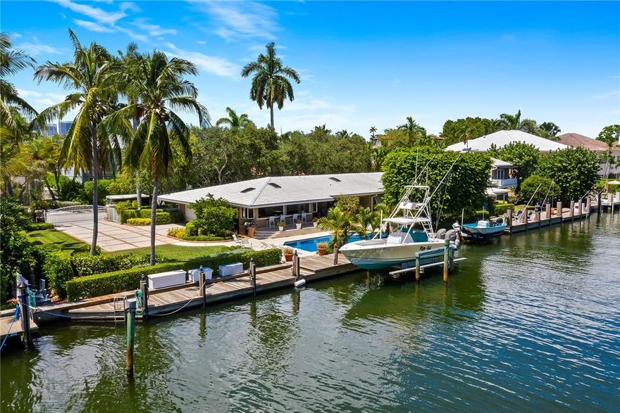 RARE opportunity to own one of the last dividable 200' lots in Las Olas. Have the option to BUILD YOUR DREAM HOME/S. SPRAWLING classic Florida waterfront estate offering 200'WF /direct ocean access (2boat lifts). Features include 4 ensuite bedrooms w sumptuous master suite on 2nd floor overlooking the extensive grounds. Grand living room w gorgeous pecky cypress vaulted ceilings; formal dining room, family room. office/den & amazing billiard/entertainment w/wetbar and icemaker overlooking pool and patio area. Full Cabana bath. Lush tropical landscaping. Amazing covered patios line the back of the house to enjoy every minute of South Florida living. Gated access to south garage (4 cars plus work shop & storage) plus additional one car garage on the north side of home